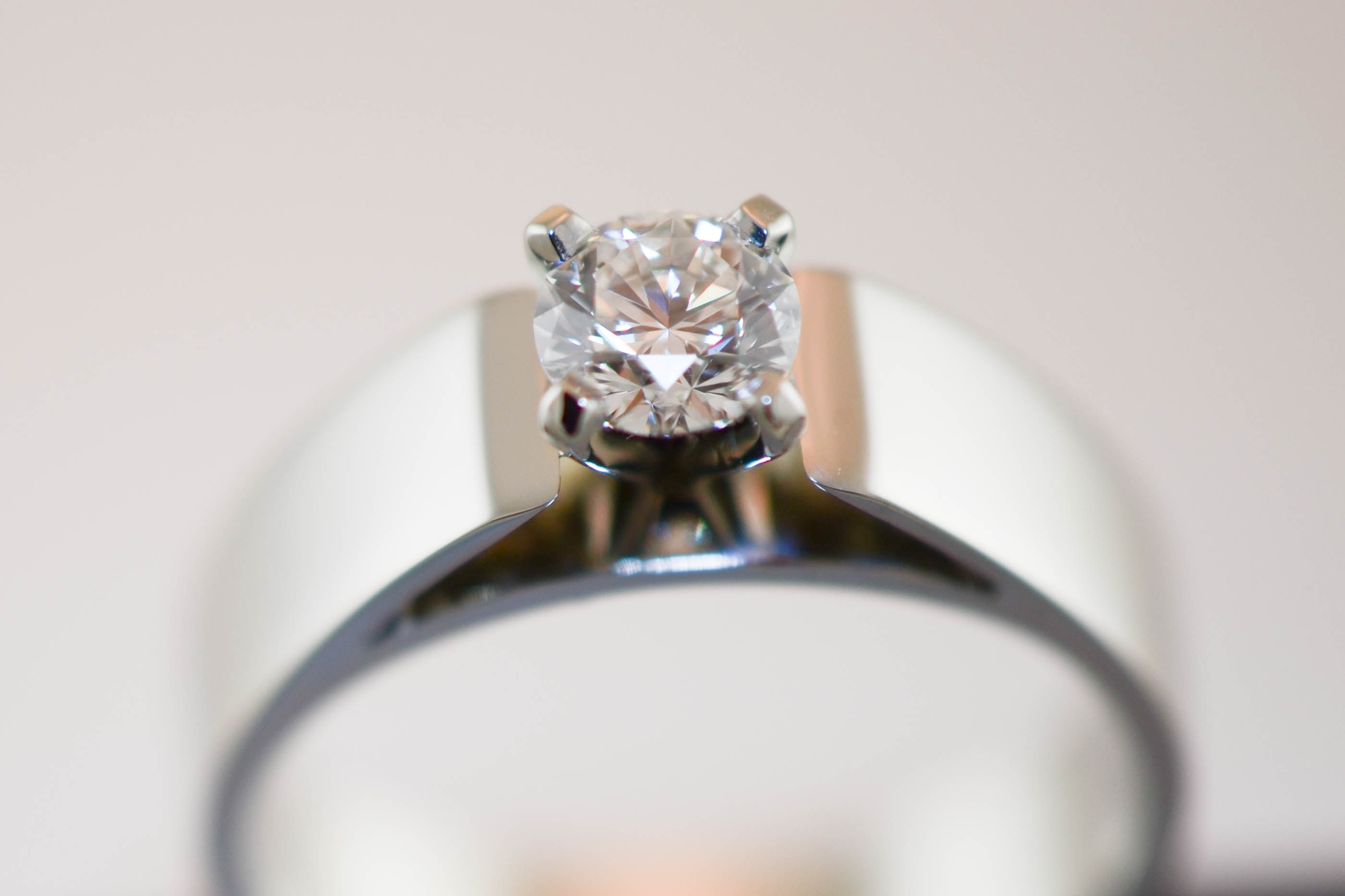 Three stone diamond ring with oval centre stone
